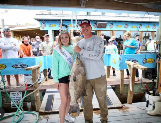 Weighing in with Miss Destin at the Fishing Rodeo