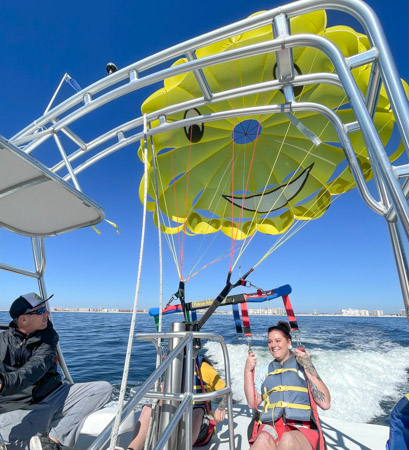 Taking off from the parasailing boat in Destin Florida